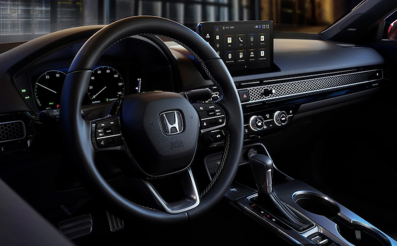 The interior of the 2025 Honda Civic features an ergonomically designed cockpit, heated seats, & a one-touch power moonroof.