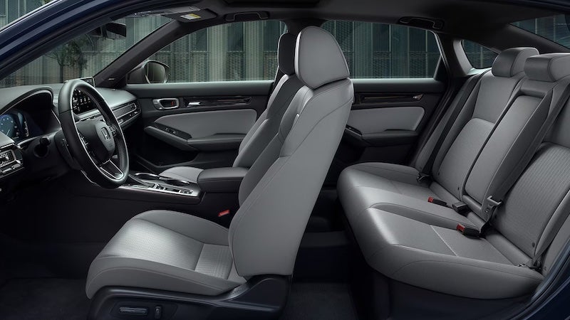 The 2026 Honda Civic Sport Hybrid combines a 2.0-liter Atkinson-cycle engine with an electric motor for 200 combined hp.